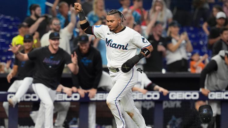 Marlins slip past Rockies 5-4 in 10 innings to cap three-game series sweep