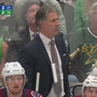 Jared Bednar lookalike sits behind him at Avalanche game