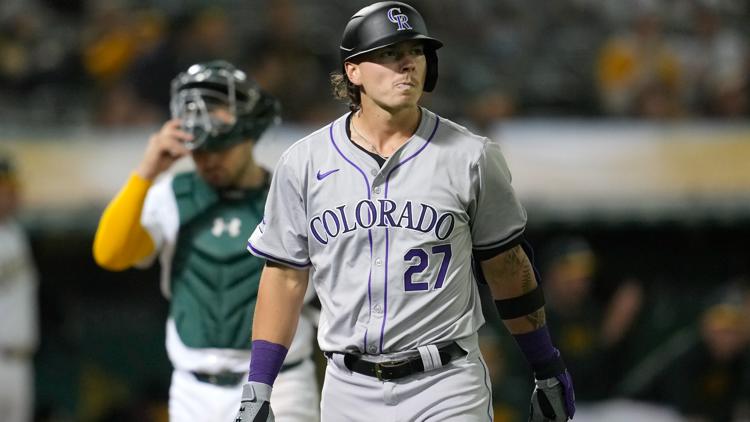 Rockies rookie outfielder breaks left hand in loss to Phillies