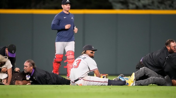 2 men accused of running onto Coors Field during Rockies-Braves game are arrested