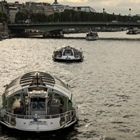 Dozens of boats cruise the Seine river in a rehearsal for the Paris Olympics’ Opening Ceremony