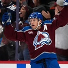 MacKinnon scores in OT to lift Avalanche past Ducks 4-3 for 1st win