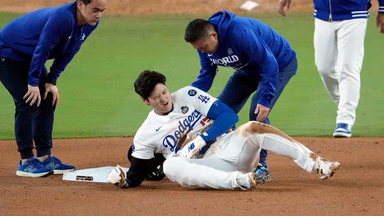 Shohei Ohtani partially dislocates left shoulder during World Series Game 2,...